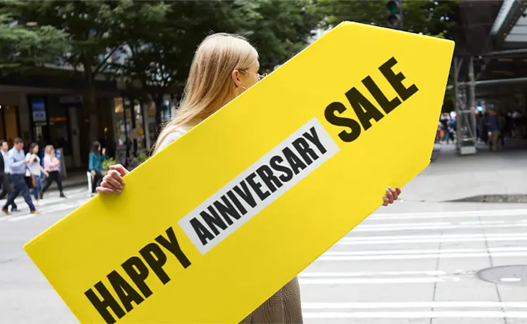Blonde woman holding a Nordstrom's